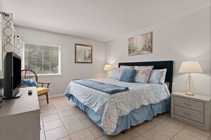 You'll sleep great in the primary bedroom's king size bed.
