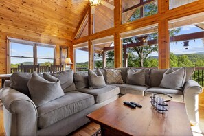 Enjoy the comfort of our plush seating while taking in breathtaking outdoor views through expansive glass windows