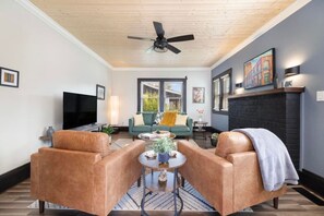 Relax and unwind in this spacious living room, perfect for family gatherings or movie nights.