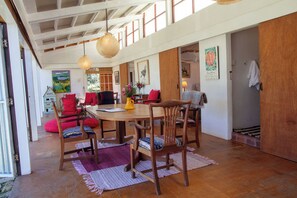 Dining table with living space behind.