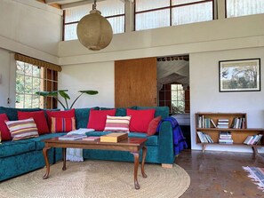 Lounge with sliding door into master bedroom behind