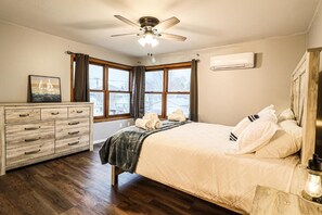 Primary Bedroom is spacious. & comfortable. Has a nightstand, dresser, & closet