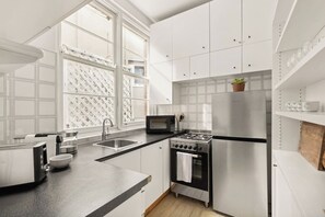 The kitchen comes well-equipped to prepare meals at home and offers a coffee machine to help you start your day.
