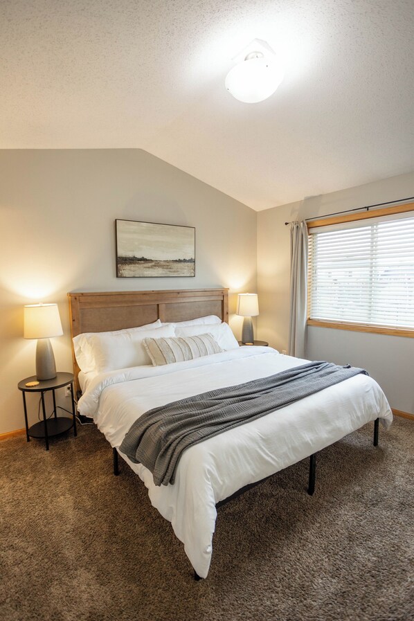 Enjoy a relaxing night away in the primary suite king bed!