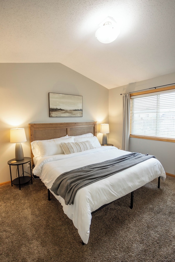 Enjoy a relaxing night away in the primary suite king bed!
