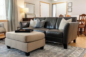 Snuggle in & put your feet up while watching your favorite show on the smart TV.