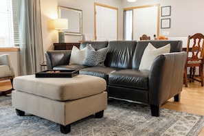 Snuggle in & put your feet up while watching your favorite show on the smart TV.