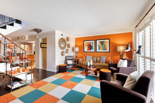 Cozy and spacious living area with TV