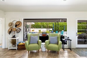 Floor-to-ceiling glass doors in the living area