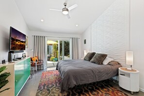 The primary king suite offers an adjustable bed frame for ultimate comfort