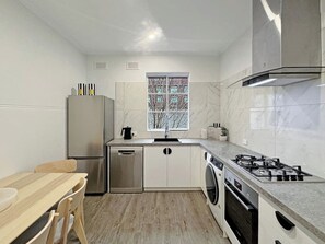 Kitchen with stainless steel applicances including fridge/freezer