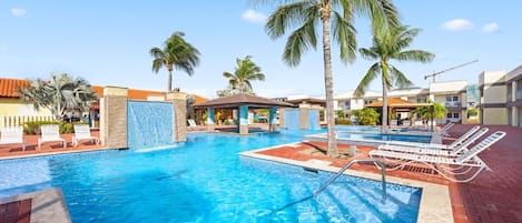 Our stunning pool area offers the perfect blend of fun and tranquility. Dive into crystal-clear waters, lounge on stylish chairs, or soak in the sun while surrounded by lush landscaping.