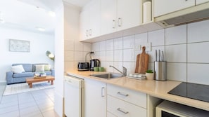 Kitchen with stove, dishwasher & microwave