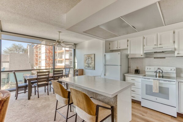 Functional kitchen providing essential appliances creating a clean and practical cooking space.