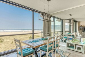 Dine with the ocean as your backdrop! Experience ultimate relaxation in this bright, beachfront haven. 