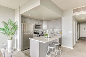 Functional kitchen providing essential appliances creating a clean and practical cooking space