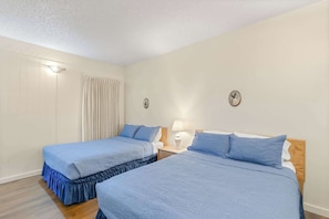 Spacious room with two queen beds.