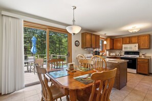 Large kitchen that leads to the deck