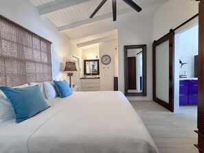 Kas di Almendra’s bedroom invites you to slow down and savor each moment. Wake up refreshed in the spacious king bed, with sunlight filtering through and a charming sliding barn door that opens to the heart of the home—the kitchen.