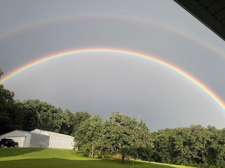 Double Rainbow over the hut in the summer time.