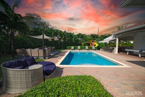 Experience the luxury of outdoor living by the pool.