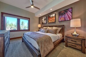 Unwind in the serene master bedroom, featuring a plush king-sized bed, tasteful decor, and plenty of natural light.