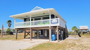 Sun-soaked views cascade across the entire living space. Enjoy fresh air sitting under the covered deck or cozy up inside and bask in the natural light filtering through the expansive windows.