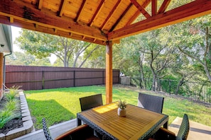 Covered Patio | Fenced-In Backyard | Creek Views