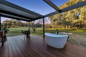 Outside bath on deck overlooking acreage