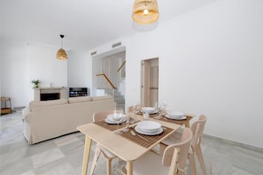 Dining area for four guests on a side of the living room