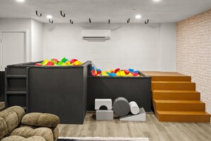 Let the fun begin! This playful bedroom features soft foam cubes for kids to jump, stack, and create—perfect for endless imagination and safe adventures