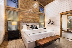 This is the cabin's primary bedroom, thoughtfully decorated to create a relaxing vibe.