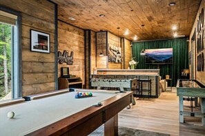 The lower level of the cabin also includes a combination game room and theater room.