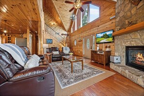 Spacious living room with gas fireplace & TV