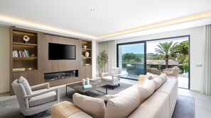 Bask in natural light while enjoying serene views from this luxurious living room.

#Algarve #Portugal #LuxuryLiving #SunlitSpaces #RelaxInStyle