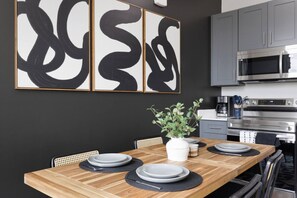 The dining area invites you to savor every moment, whether enjoying a quiet meal or hosting a festive gathering.