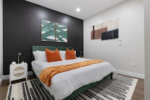 Bright and welcoming room with queen bed, perfect for families or friends traveling together.