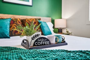 Enjoy morning coffee on the luxurious bed