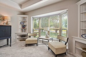 A cozy seating area off the living room, perfect for long conversations or enjoying a good book.