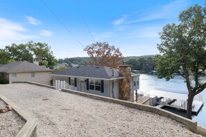 Charming lakeside home with a private dock and beautiful water views, offering a peaceful retreat.
