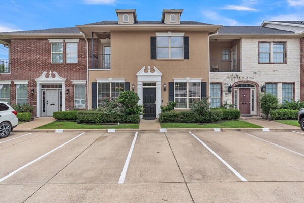 Exterior Front of Condo with 3 Reserved Parking Spaces (4 Total Reserved Spots)