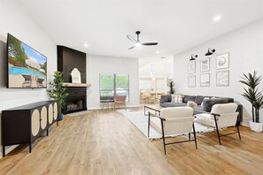 Cozy living room with a fireplace, perfect for watching movies or relaxing with the family
