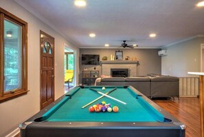 Enjoy a game of pool with loved ones in this unit’s dedicated recreational space.