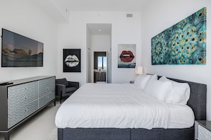 Bedroom: Features a queen size bed and a TV