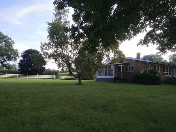View of the Cottage and extensive lawn & grounds.