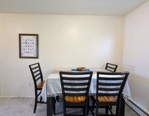 Dining table sits 4 people.