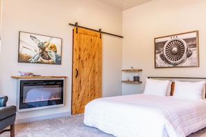 Master bedroom with King size bed, cozy cotton linens, closet, and TV