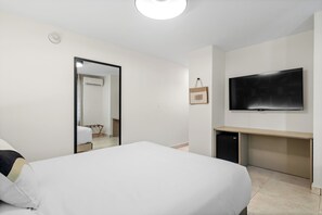 Your home away from home, complete with a dreamy bed and a big television.