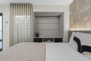Well-appointed room with ample storage space and in-room coffee and tea making facilities.









