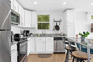 Kitchen: Enjoy cooking in our fully equipped kitchen with stainless appliances and ample natural light